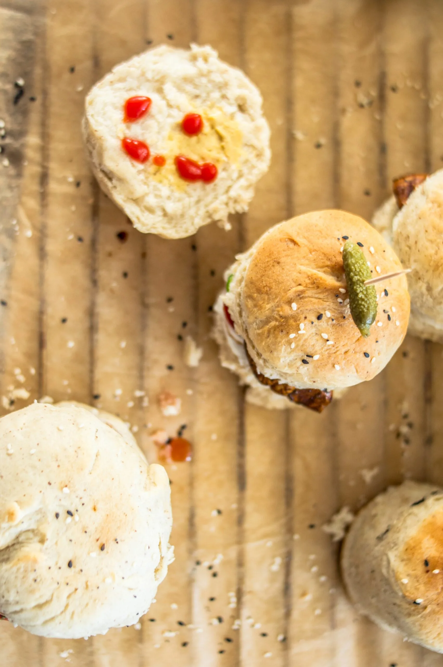 Stack of soft, golden fast vegan burger buns on a cooling rack, ready to be filled